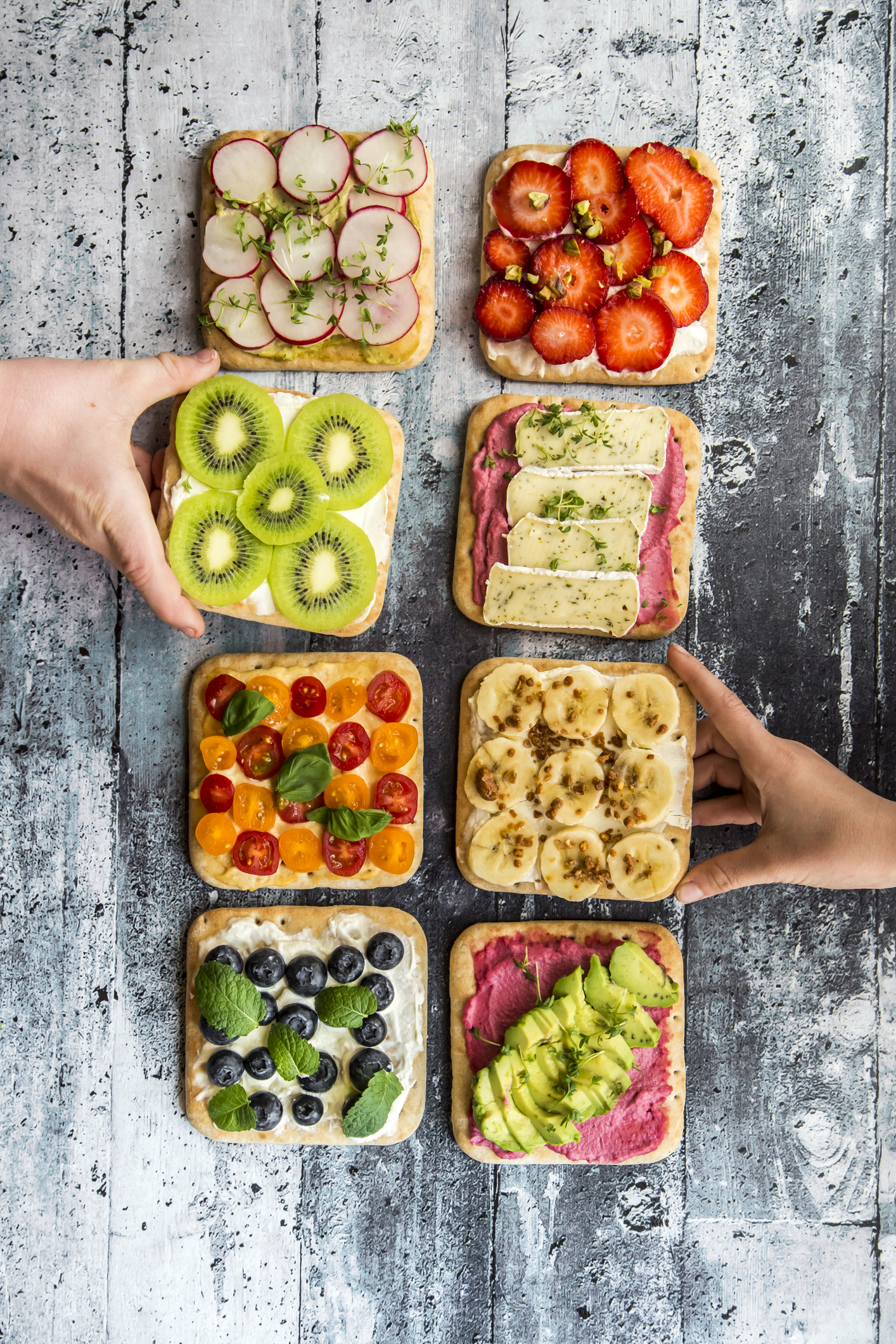 Childrens hands taking garnished sandwiches