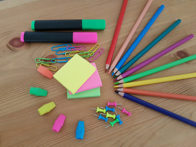 High Angle View Of Multi Colored School Supplies On Table